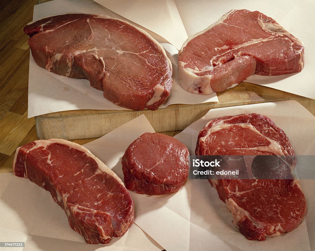 Cuts of raw beef on butchers paper. Cuts of beef. Beef Stock Photo