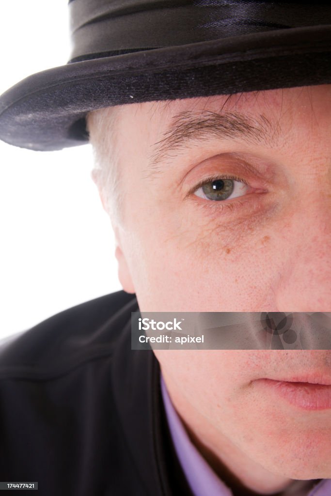 stay A man staring at the camera with a bowler hat on. For more great pictures of seniors please visit my lightbox: Adult Stock Photo