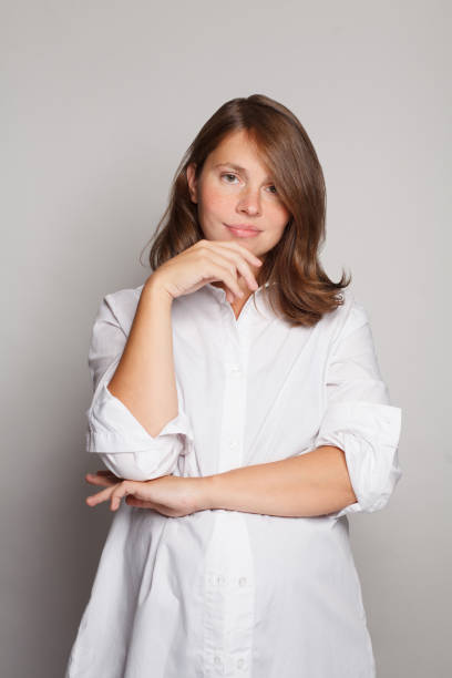istock Happy pregnant woman standing on white studio background 1744778164