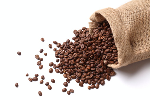 Coffee beans in sack on white