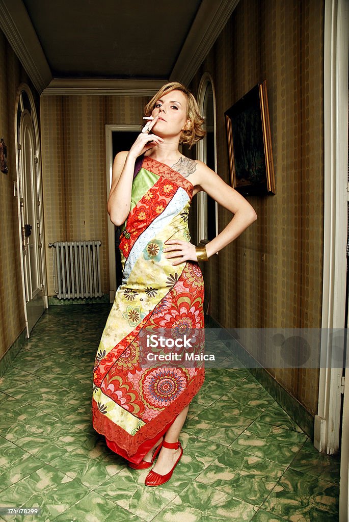 Smoking I hope Girl smoking at her home's entrance hall. 30-34 Years Stock Photo