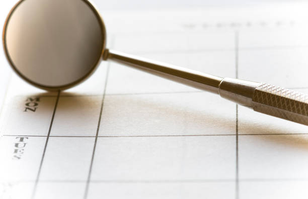 istock Dental Mirror and Appointment Book 174478326