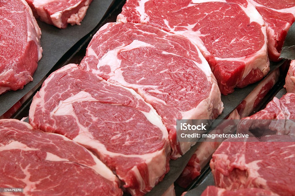 Fresh Ribeye Steaks at the Butcher Shop Meat Stock Photo