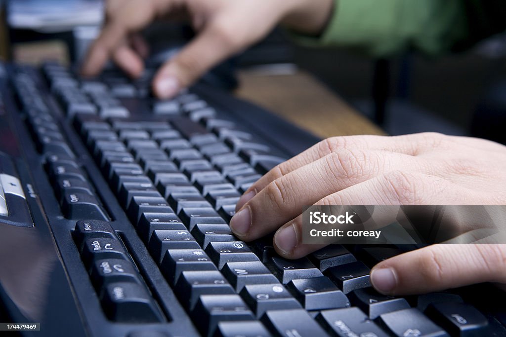 using computer series "a man work on a computer, using keyborad and typing. You may interest:" Adult Stock Photo
