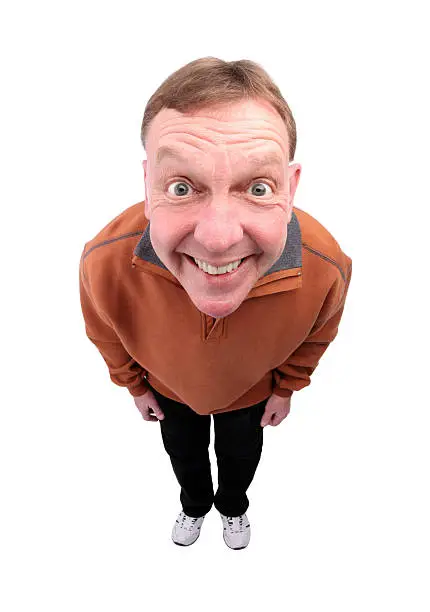 A fisheye image of a smiling middle aged man.