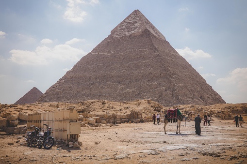 asian archaeologist working an research the pyramid pharaoh in Giza Cairo