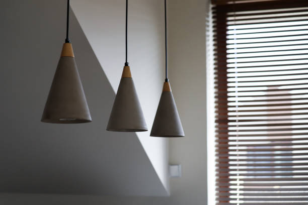istock Set of three modern ceiling lights in the living room. 1744806631