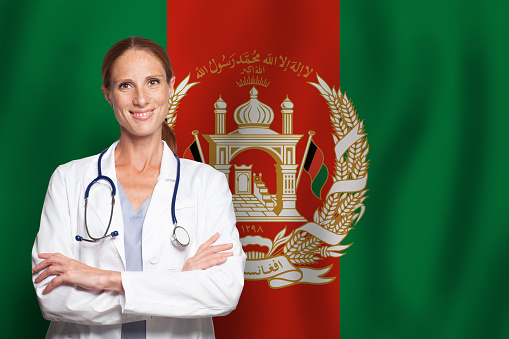 Afgan general practitioner doctor gp on the flag of Afganistan