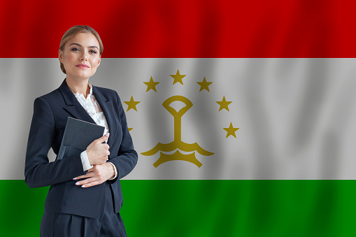 Tajikistani businesswoman on the flag of Talikistan digital  nomad, business, startup concept