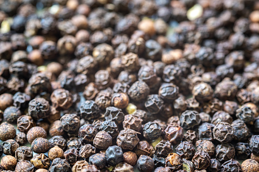 Close-up of a large pile of black peppercorns