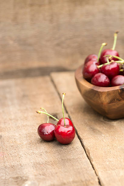 istock Fresh Summer cherries in wooden bowl 174481818