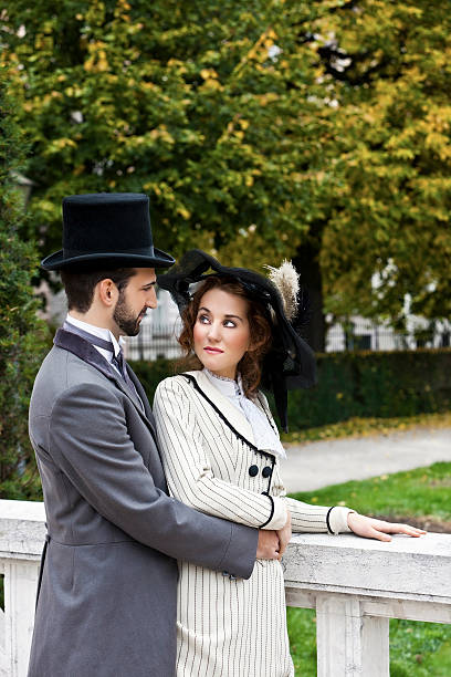 istock Old-fashioned dressed couple in the park 174481911
