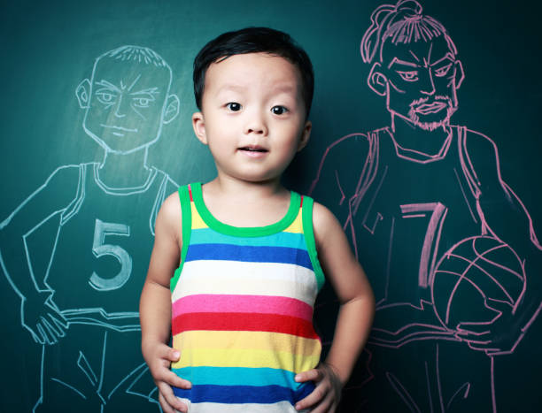 istock cute little boy playing basketball 174481988