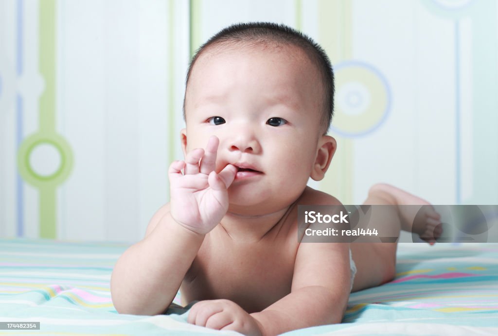 My Baby playing in bed My Baby playiMy Baby playing in bed 6-11 Months Stock Photo