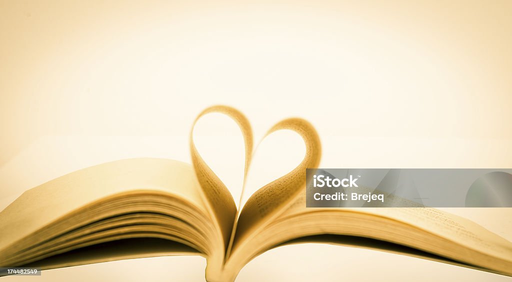 opened book opened book and heart shape Book Stock Photo