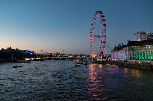 London, England - Sep 7, 2021: The London Eye, or the Millennium Wheel at sundown.