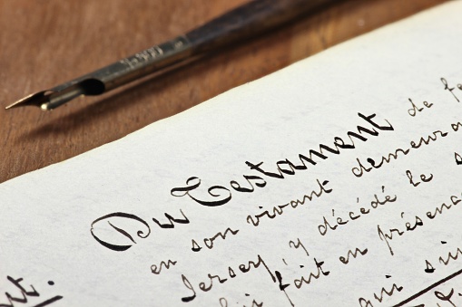 handwritten testament on desktop