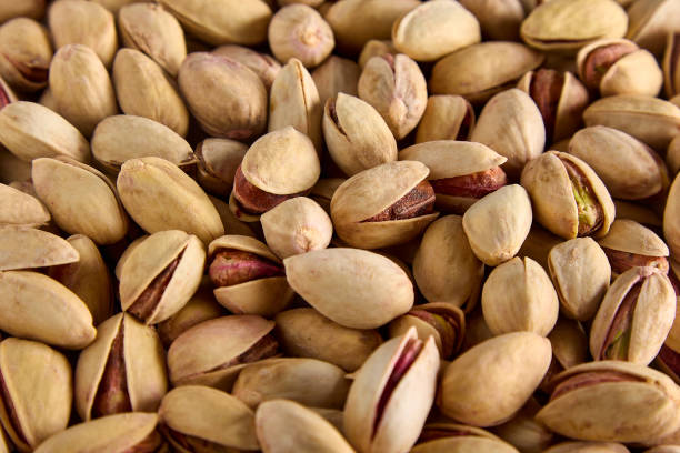 istock Delicious mouthwatering roasted pistachios in the shell as a background 1744841015