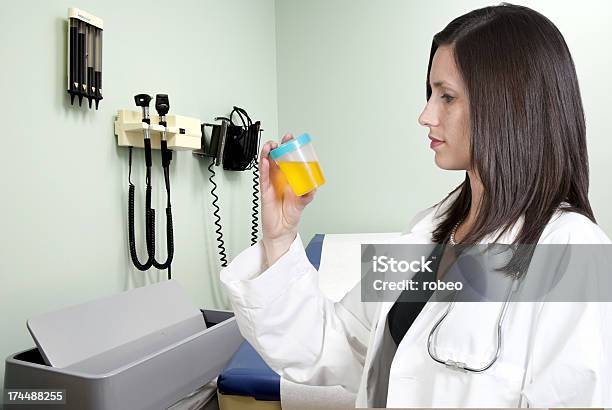 Woman Doctor With Urine Sample Stock Photo - Download Image Now - Adult, Beautiful Woman, Coat - Garment