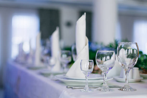 istock wedding reception. tables with plates, wineglass and napkins. 1744891771