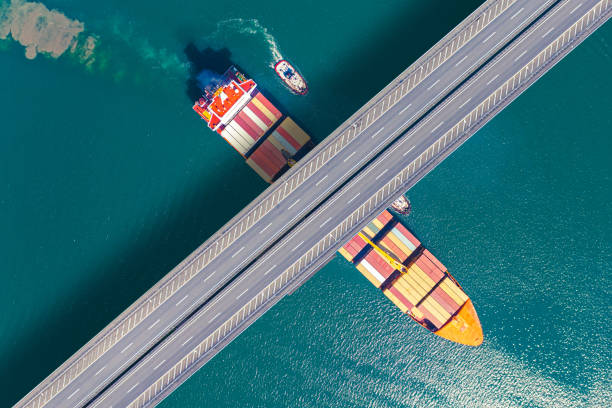 istock Aerial view of a cargo ship passing under bridge. 1744900563