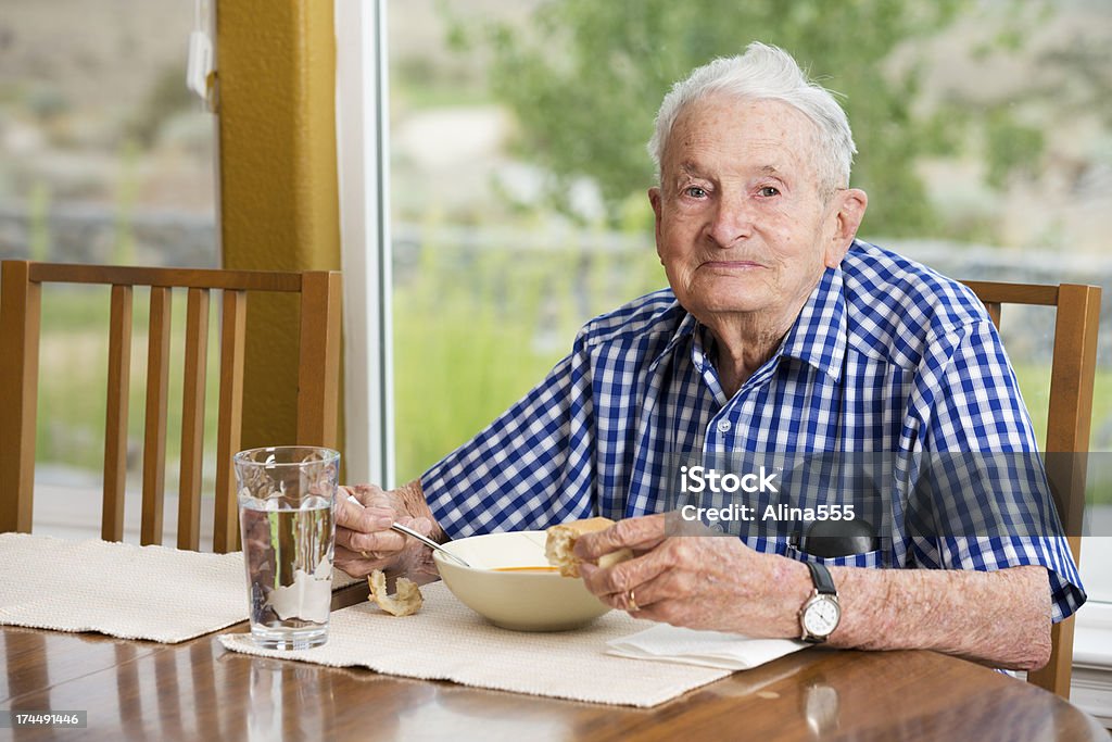 Senior man in his 90s eating lunch at home Senior man in his 90s eating lunch at home.  You might also be interested in these: Eating Stock Photo