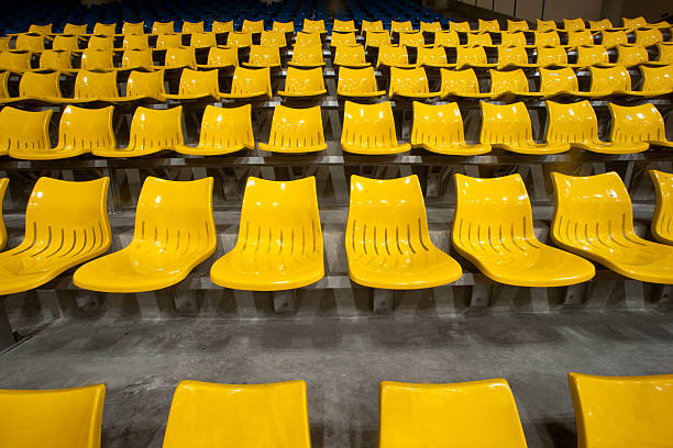 istock Yellow plastic seats at Basketball stadium . 174491462