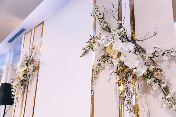 istock the wall with initials is decorated with branches and flowers. w 1744918943