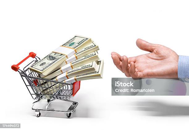 Businessmans Hand Shopping Cart Full Of American Dollar Banknotes Stock Photo - Download Image Now