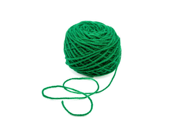istock Beautiful bright green wool on a light background. 1744943564