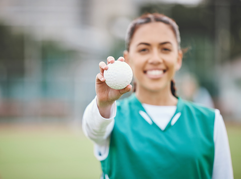 Female, person and smile for hockey with ball in hand on field for competition, match or workout. Girl, happy and confident with sports, equipment or gear for game, training and health for wellness