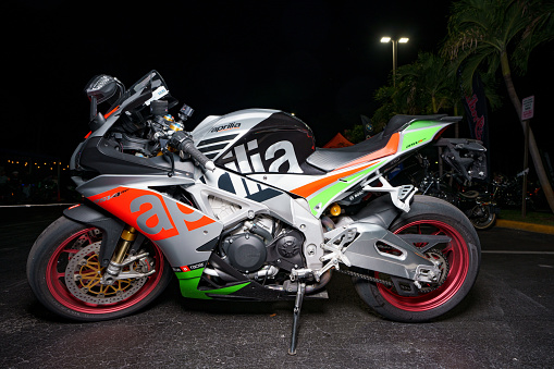 Fort Lauderdale, FL, USA - October 18, 2023: Night flash photo of an Aprilia Italian racing motorcycle