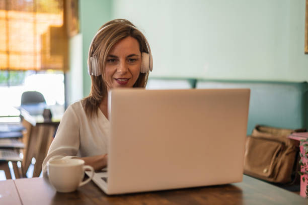 istock Self-employed having a video conference in a coffee shop 1744958721