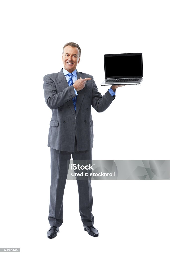Empresário maduro mostrando um novo laptop - Foto de stock de Homens royalty-free