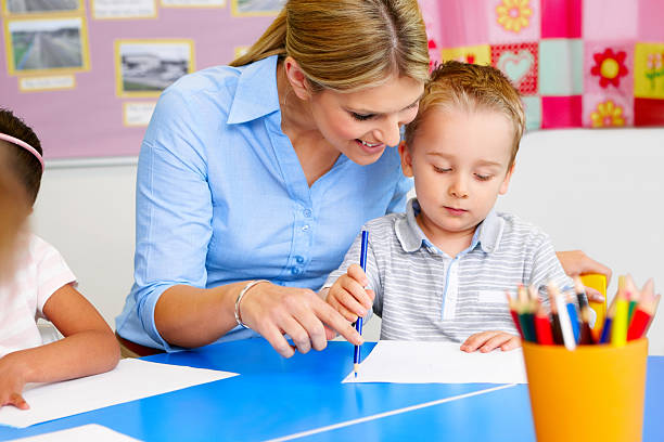 istock Little kids and teacher in art class at nursery 174496764