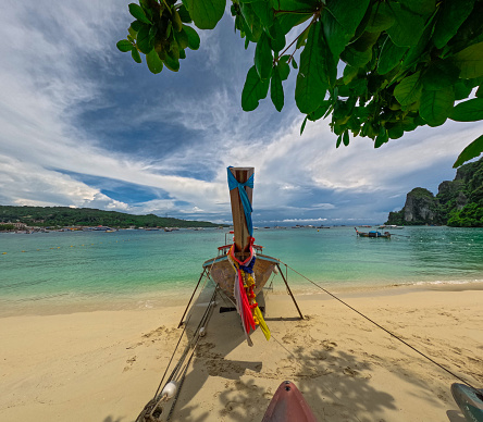 Phi Phi island one of the wonders of beauty just off the coast of phuket thailand. Phi phi island is famous for turquoise clear blue waters teaming with Corel reef fish white soft sand