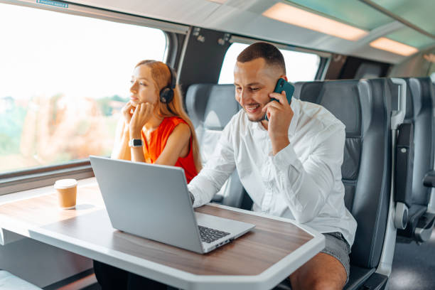 istock Freelance partners enjoying a train ride with technology 1744987585