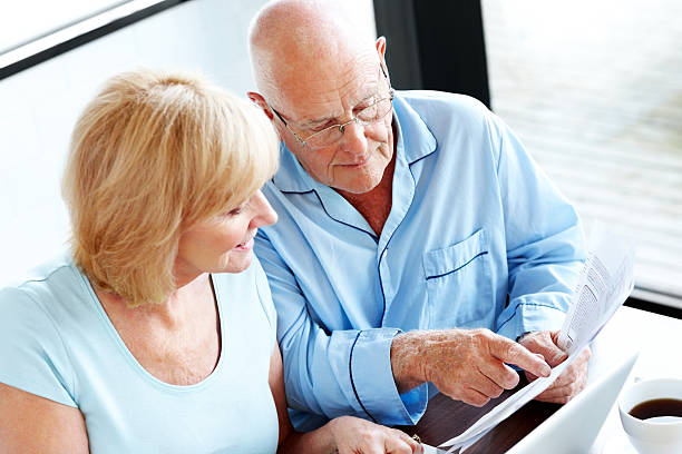 istock Mature couple calculating their monthly expenses 174499298