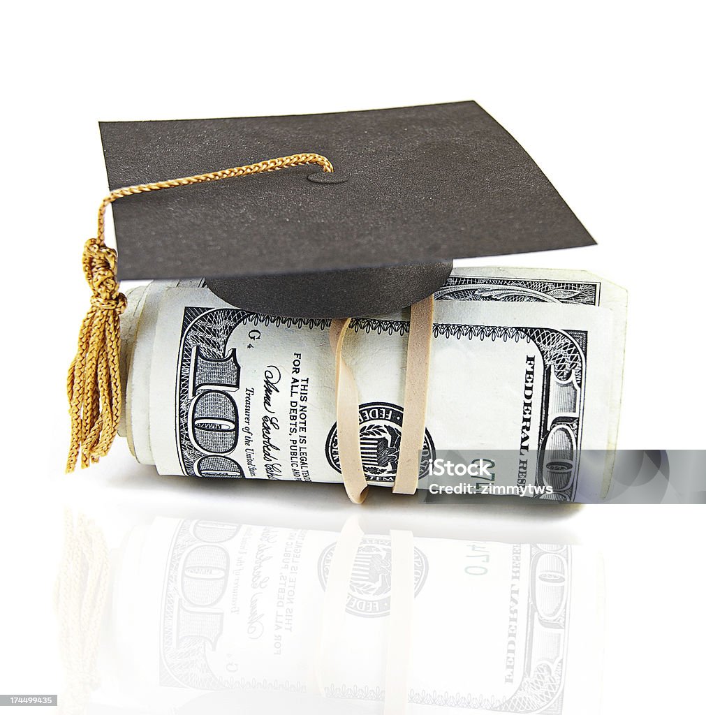 salary grad mini graduation cap on rolled up cash Cap - Hat Stock Photo