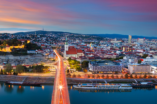 Aerial cityscape image of Bratislava, capital city of Slovakia during beautiful autumn sunset.