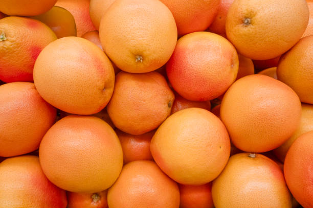A macro shot of a fresh ripe grapefruit