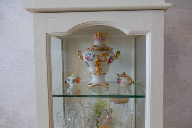 istock Glass cabinet with ceramic teapot, samovar 1745018693
