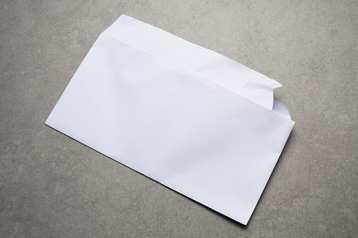 White torn envelope with copy space on table