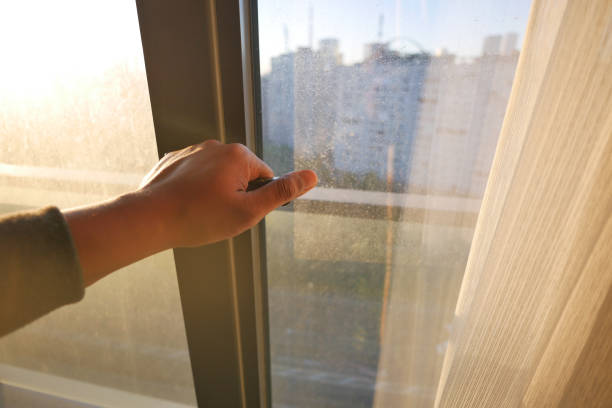 istock hand open gray plastic pvc window at home at early morning 1745023176