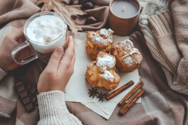 istock Cup of coffee in hands, cozy autumn 1745027738