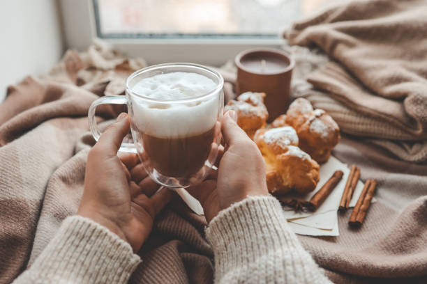 istock Cup of coffee in hands, cozy autumn 1745027739