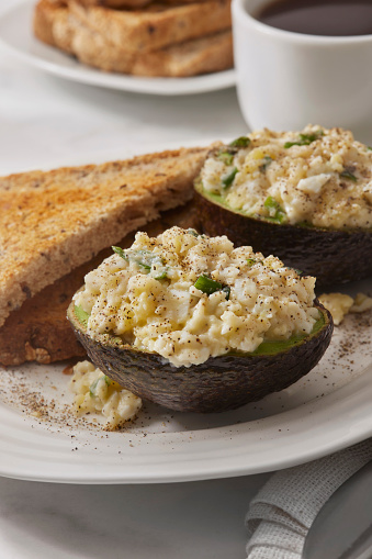 Avocado Egg Salad Boats with Green Onions and Whole Grain Toast