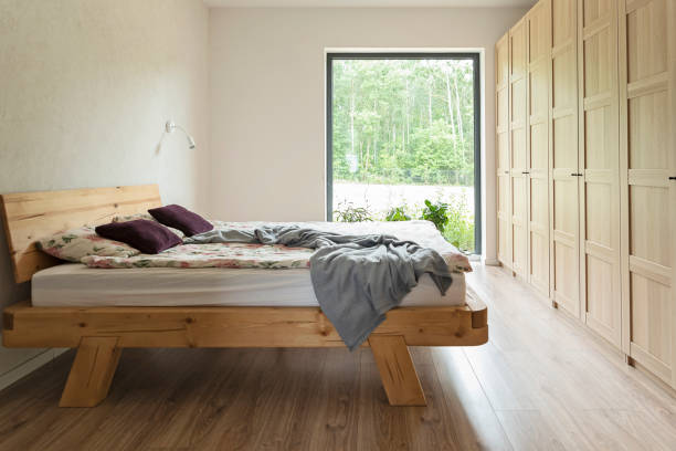 istock Modern bedroom with double bed and window. Home interior. 1745135115