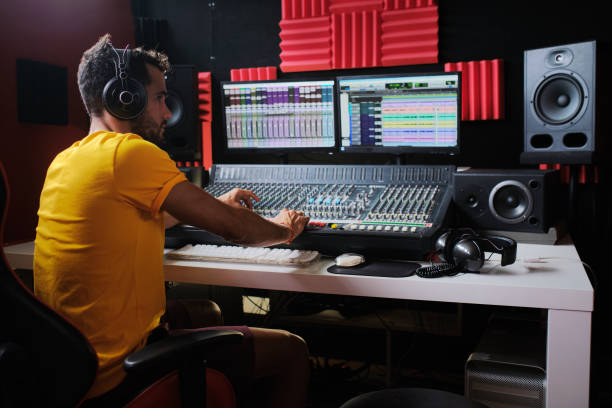 istock Sound technician working sitting in front of the sound mixing table. 1745143878