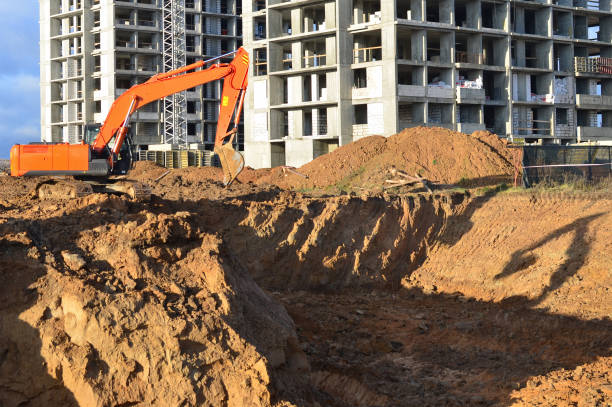 istock Excavator on groundwork on construction site. Backhoe dig foundation for house construction. Excavation works on building    construction. Excavator Machinery on earthworks. Tower crane in build. 1745180638